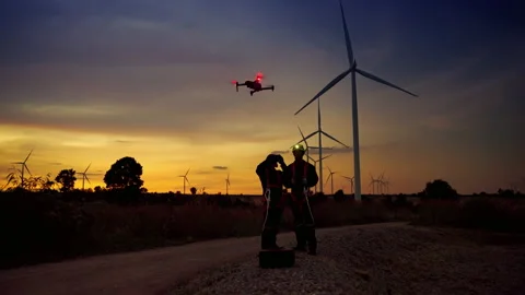 Turbine maintenance engineers are using drones to observe maintenance points Stock Footage 165051889