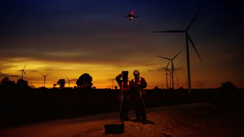 Turbine maintenance engineers are using drones to observe maintenance Stock Footage 165473378