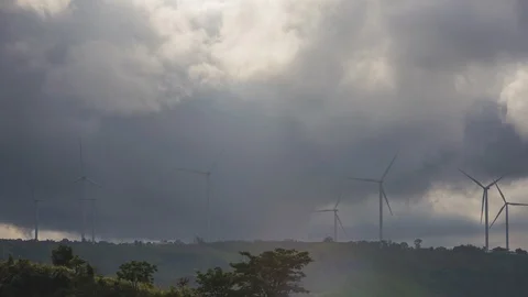 Turbine rotating over white cloud and sky sunset timelapse Stock Footage 92766458