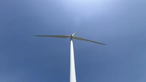 Turbine Tower Reaching High Into Blue Sky Stock Footage 332814717