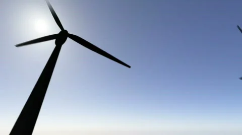 Turbines against blue sky loop Stock Footage