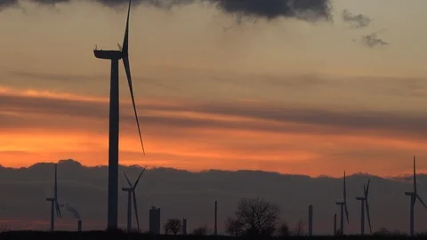 Turbines in the evening light with power lines 4K Video stock 99056076