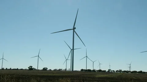 Turbines spinning in a field Stock Footage 276345778