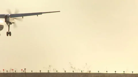 TURBO-PROP LANDS AT SUNSET Stock Footage