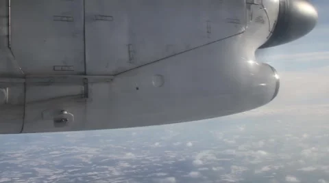 Turbo propeller plane flying above clouds Stock Footage 1033655