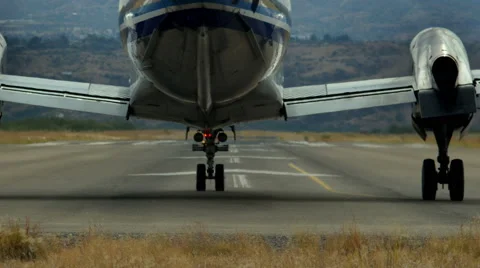 A turboprop airplane taking off Stock Footage 68987686