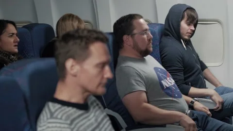 Turbulence on an airliner causing panic | Stock Video | Pond5