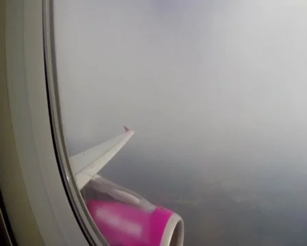 Turbulence flying through clouds, airplane shaking porthole view, click for HD Stock Footage 43966620