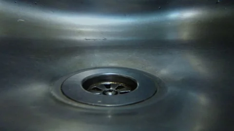 Turbulence in the sink drain Stock Footage 97328890