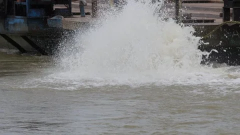 A turbulence in the water due to active engine of a cargo Stock Footage 314513361