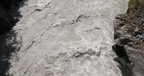 Turbulent Dirty river with muddy yellow water in flooding period Stock Footage 261278043