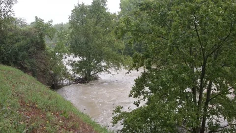 The turbulent flow of the Vienna River has overflowed its banks and flooded the  스톡 동영상 284737480
