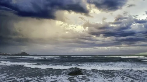 Turbulent Ocean Waves Under a Dramatic Stormy Sky and Dark Clouds Stock Footage 320040572