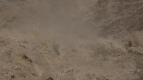 TURBULENT ROARING WATER EXITING A HYDRO DAM IN THE HIMALAYAS Stock Footage 117177145