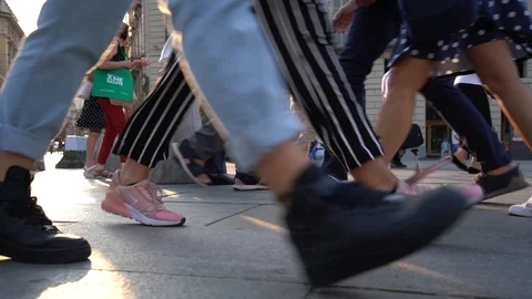 Turin: A ground level slow motion of people walking in Piazza Castello Stock Footage 116056293