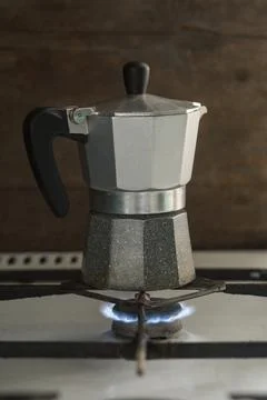 Turk coffee maker stands on a gas stove. Visible fire Stock Photos