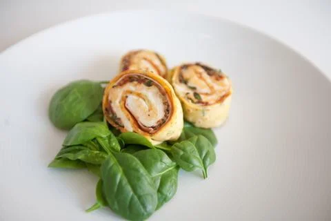 Turkey and spinach wraps with ricotta and pine nuts Stock Photos