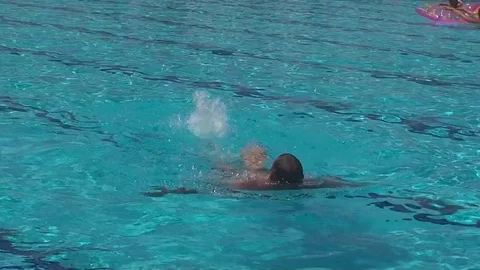 Turkey, Antalya, August 20, 2015, a middle-aged man floating on back in pool Vídeos de archivo 74621092