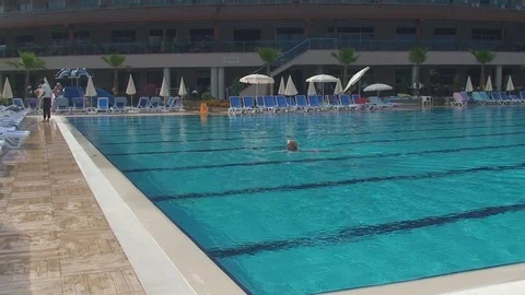 Turkey, Antalya, August 20, 2015. early in the morning, a lone swimmer swims in Vídeos de archivo 75763480