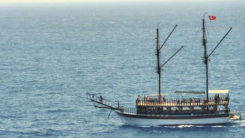 TURKEY, ANTALYA - August 20 , 2017 : A tourist ship with tourists sails by sea. Stock Footage 80212935