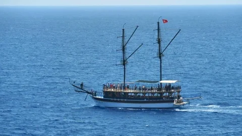 TURKEY, ANTALYA - August 20 , 2017: A pirate ship with tourists is moving along. Video stock 80395633