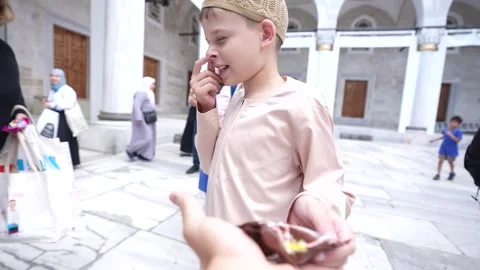 Turkey: British boys Cake Not Hate campaign reaches Istanbul mosques Stock Footage 340404128