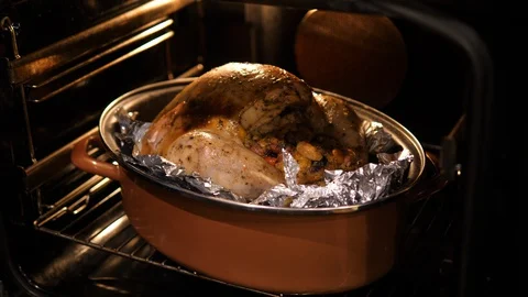 Turkey cooking. Closing open Oven. Family food preparation for Christmas Closeup Stock Footage