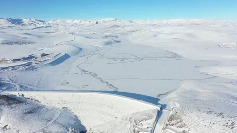 Turkey: DRONE - Dam freezes over amid drastic temperature drop in easter... Stock Footage 325845784