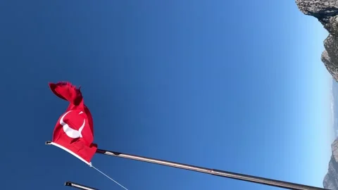 Turkey flag waving against deep blue sky 4K 60fps vertical video Stock Footage 148042570