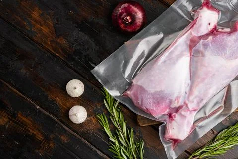 Turkey legs vacuum pack, top view flat lay, with copy space for text, on old  Stock Photos