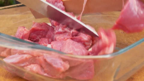 Turkey meat is folded into a glass baking dish. Stock Footage 88732679