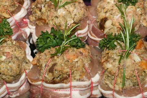 Turkey parcels with mixed game stuffing, wrapped in bacon. Stock Photos