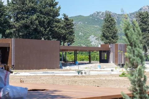 Turkey, Tasagil: Building developing in aspendos yolu with mountain backdrop Stock Photos