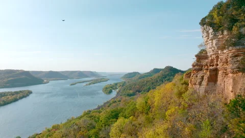 Turkey Vultures Flying Around Cliffs, Mississippi River in Wisconsin, 4K Drone Stock Footage 231198982