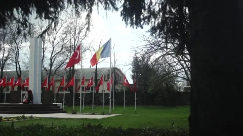 Turkish And Romanian Flags At War Memorial Stock Footage 336222281
