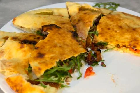 Turkish bread with stuffing. Closeup. Stock Photos