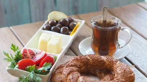 Turkish breakfast foods on the table, simit and turkish black tea Stock Footage 94159173