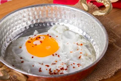 Turkish Breakfast - Fried Egg wit sliced bread on table Stock Photos