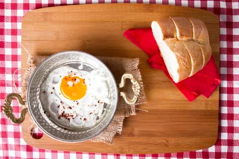 Turkish Breakfast - Fried Egg wit sliced bread on table Stock Photos