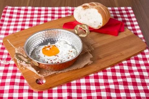 Turkish Breakfast - Fried Egg wit sliced bread on table Stock Photos
