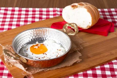 Turkish Breakfast - Fried Egg wit sliced bread on table Stock Photos