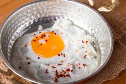 Turkish Breakfast - Fried Egg wit sliced bread on table Stock Photos