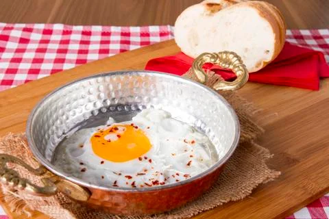 Turkish Breakfast - Fried Egg wit sliced bread on table Stock Photos