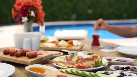 Turkish Breakfast Table Near the Pool Stock Footage 90815243