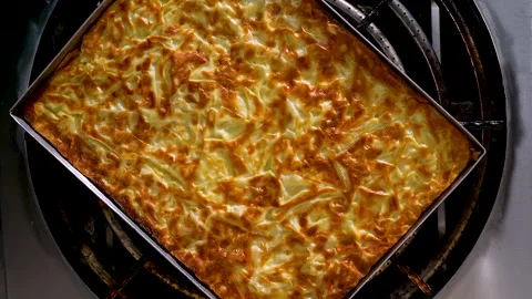 Turkish burek tray above the rotating stove Stock Footage 255009271