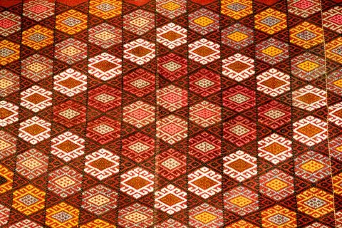 Turkish carpet with pattern has a red ornament and woven  Stock Photos