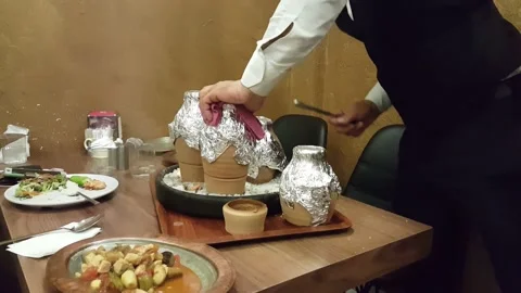 Turkish chef serving the Testi Kebab Pot in traditional way. Stock Footage 168717206