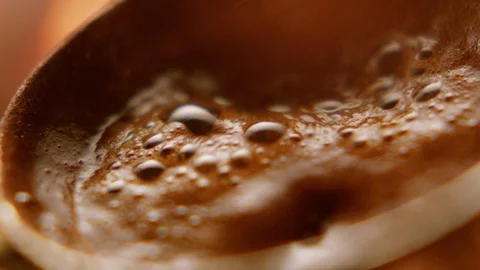 Turkish coffee is cooked in close and slow motion. Stock Footage 128442800
