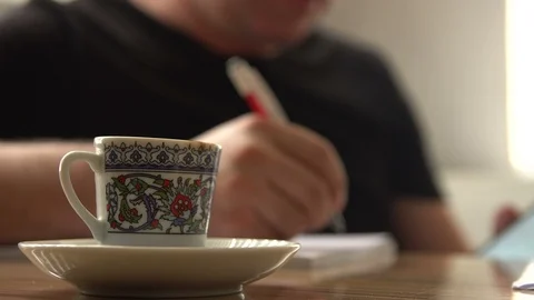 Turkish coffee cup on the table in office working man drinking turkish coffee. Stock Footage 118716813