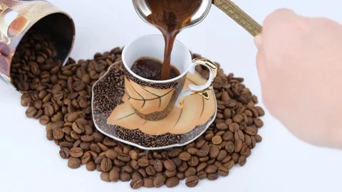 Turkish Coffee presentation in cup. Slow Motion. Stock Footage 128749017